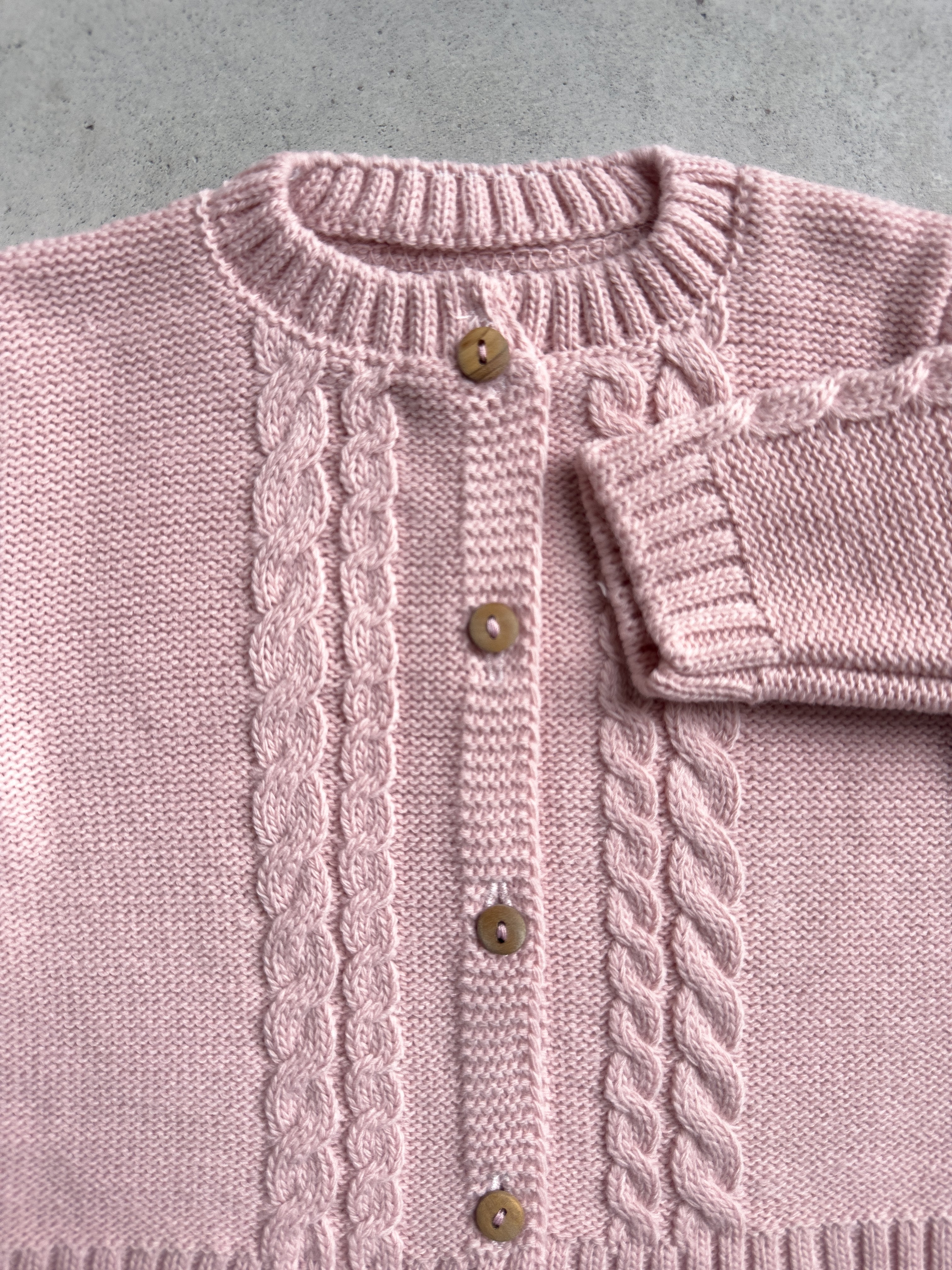 Baby breien vlechtjasje