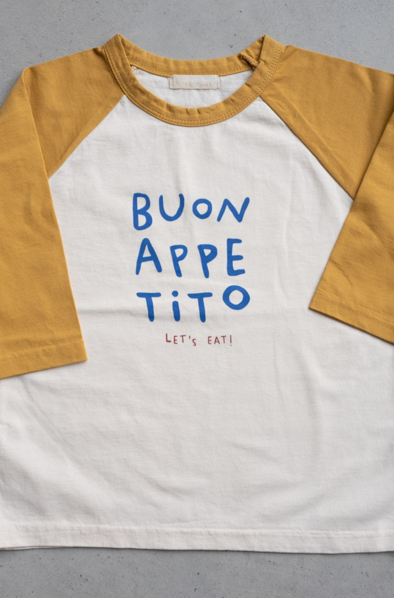 Buon Appetito Longsleeve Tee with yellow sleeves and blue lettering on white fabric, part of the cozy Every.Body selection.