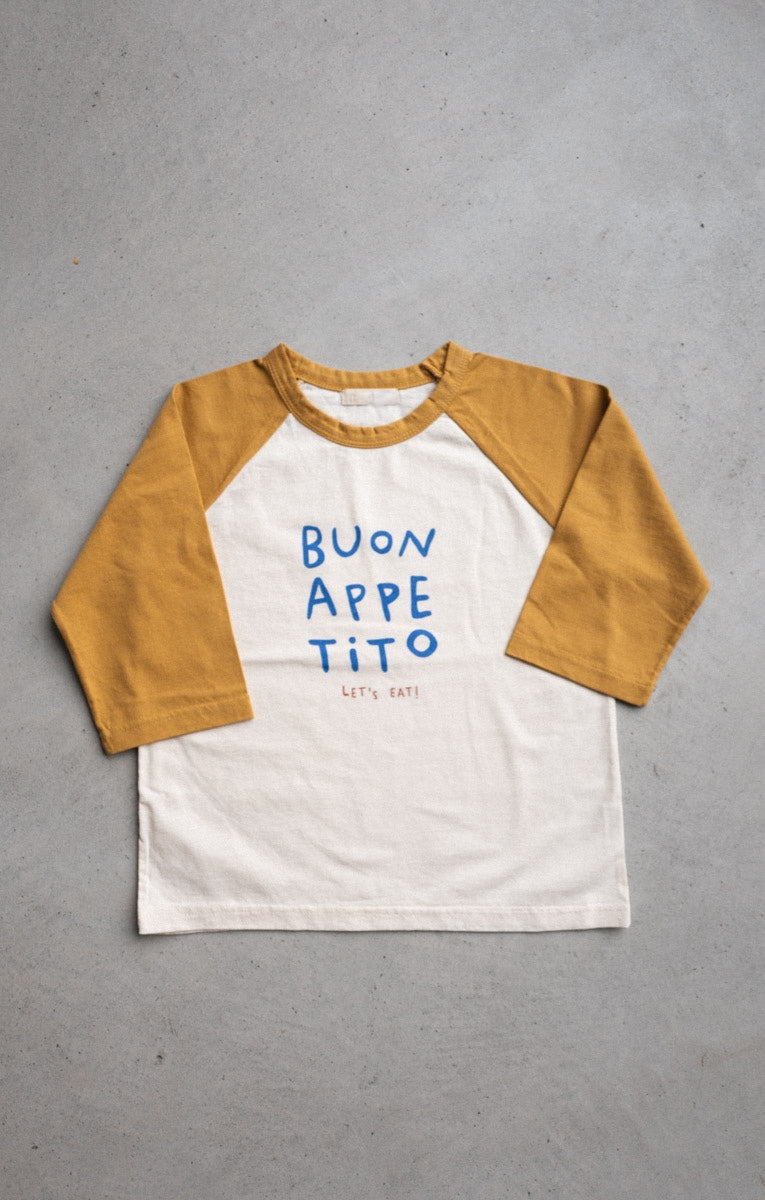 Buon Appetito long-sleeve tee with mustard yellow sleeves and blue lettering, inspired by Italian warmth and flavors.